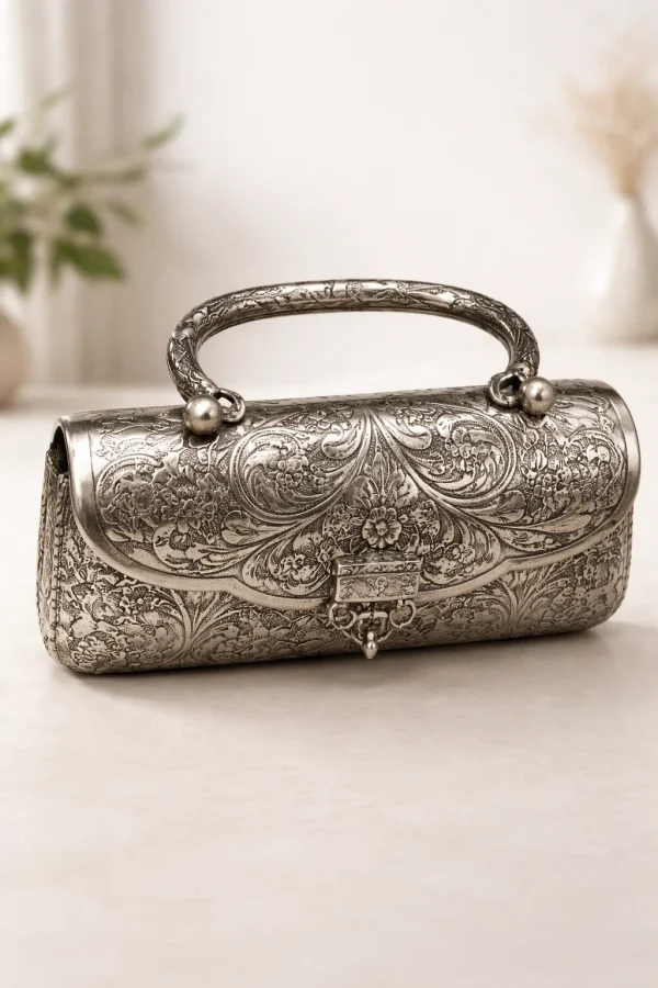 Ornate silver metal clutch