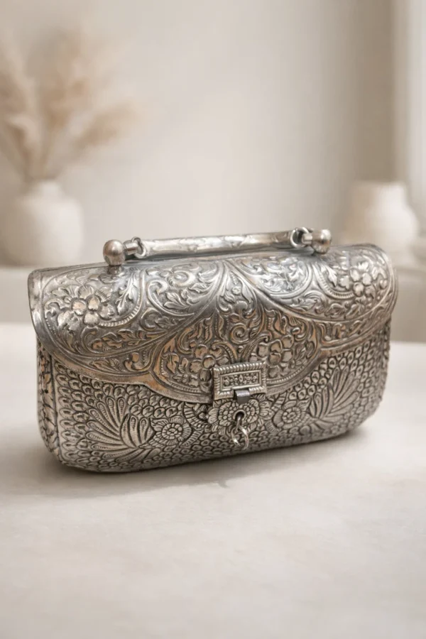 Ornate silver metal clutch