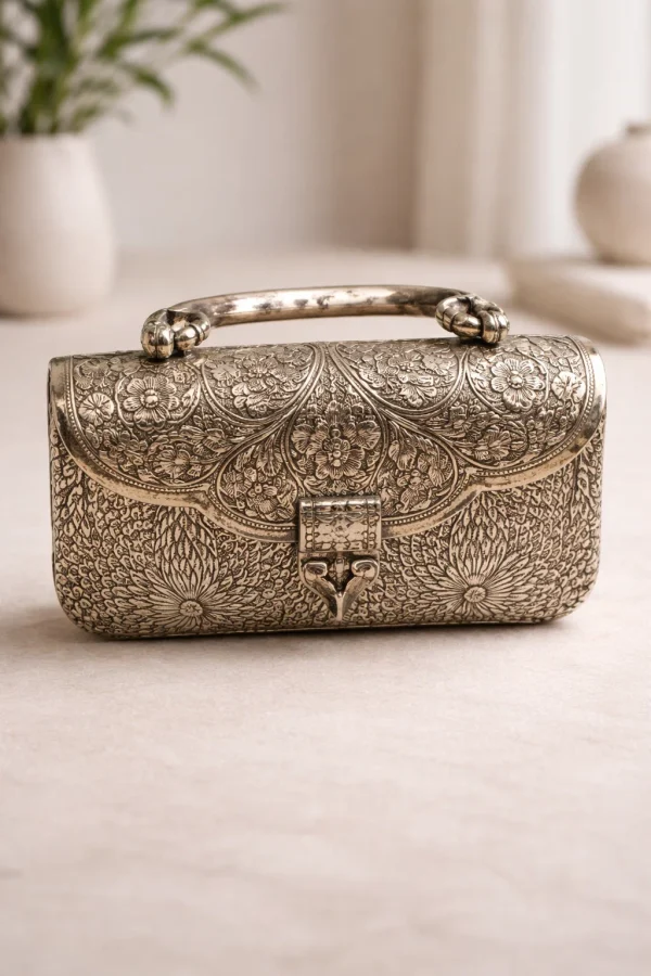 Ornate silver metal clutch