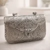 Ornate silver metal clutch